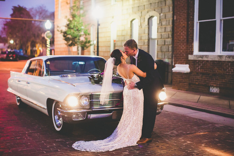 bride and groom kissing night shot