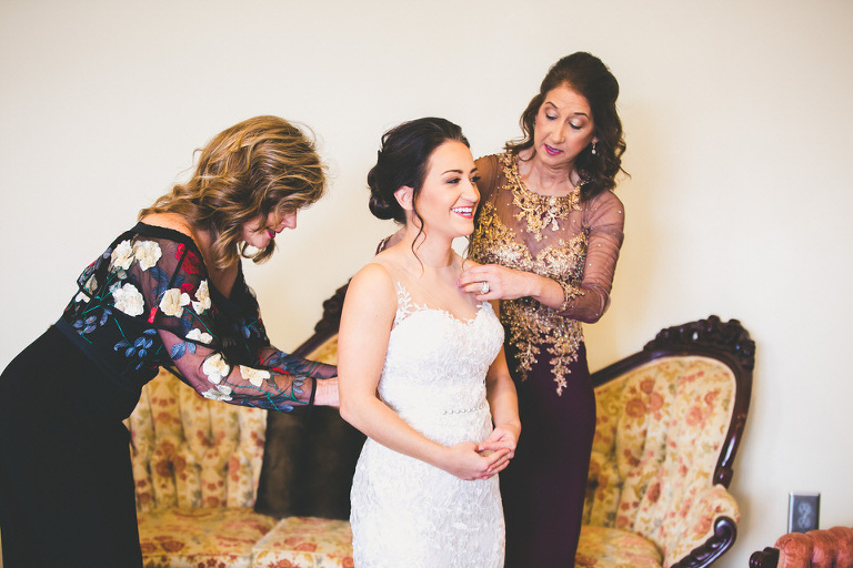 Mother of Bride helping Bride